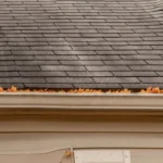 old asphalt roof with black streaks