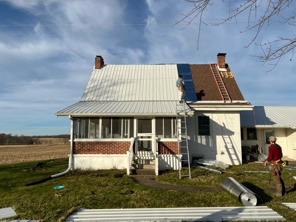 white standing seam metal roof installment