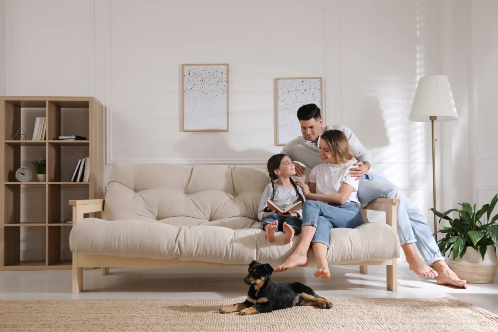 young family on couch financing new roof